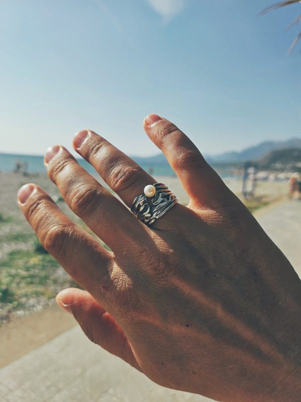 Designer wide textured ring made of sterling silver with natural pearls.