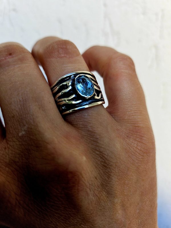 Author's ring with natural topaz Sky.