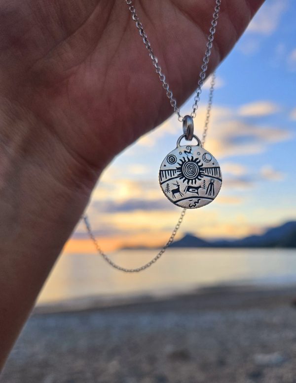 Sterling silver pendant with ancient symbols